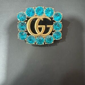 Gucci Gold and Blue Stone Logo Brooch